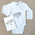 Voorbeeldfoto romper met grappige tekst en bijpassende kaart